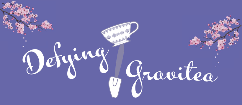Logo with cherry blossoms and text 'Defying Gravitea' on a purple background